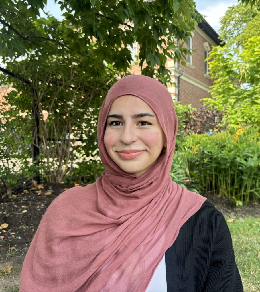 A photo of Aia Jaber wearing a rose pink hijab.